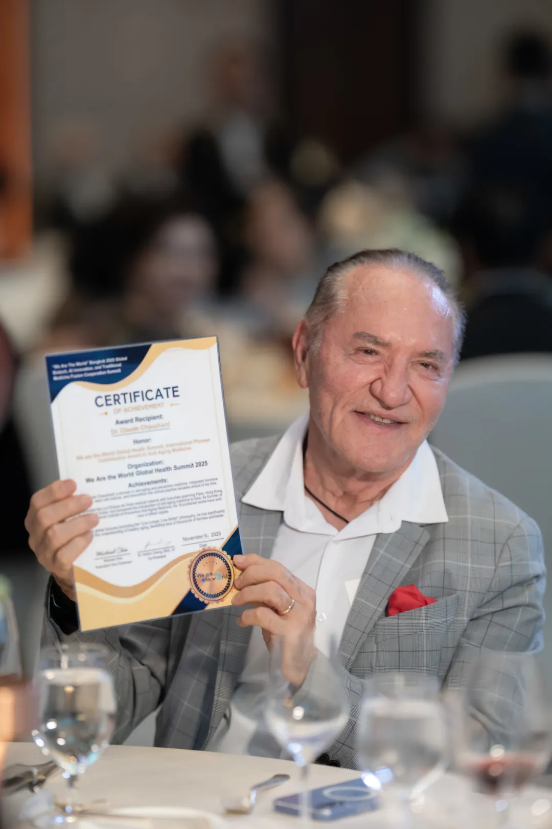 Claude Chauchard Holding Certificate